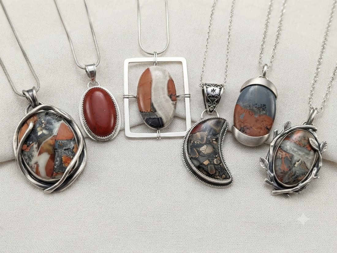 Brecciated Jasper Pendants, Rust-red, white and grey brecciated jasper; wrapped, crescent and open-frame shapes