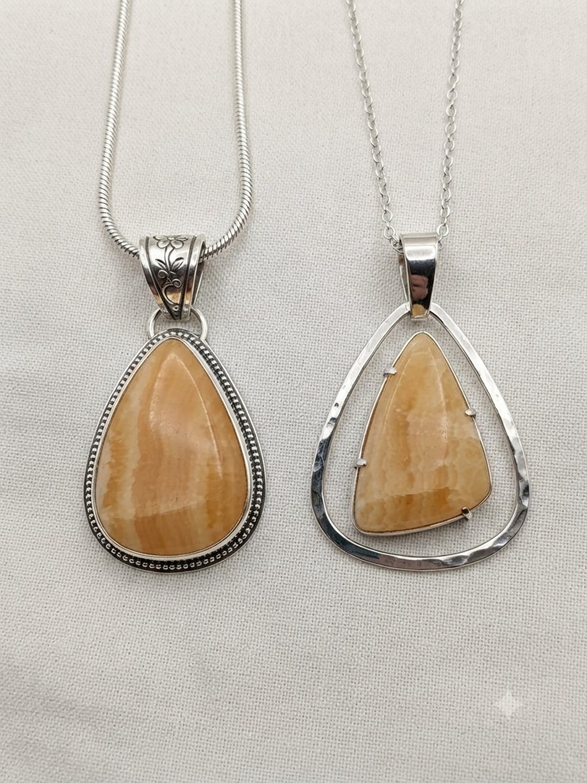 Orange Calcite Pendants, Honey-orange calcite; large teardrop in a beaded bezel or an open triangle frame