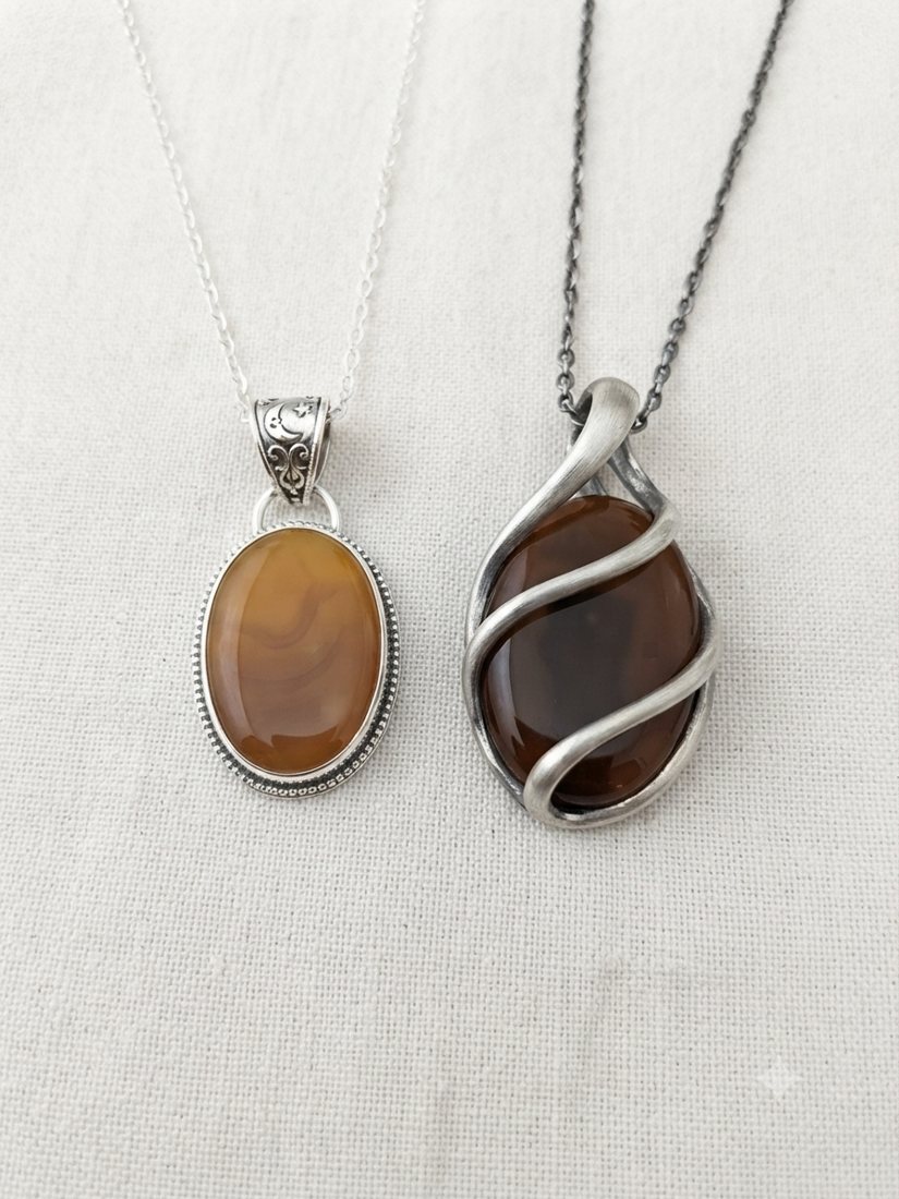 Amber Agate Pendants, Honey-amber and deep brown agate; oval and wrapped settings