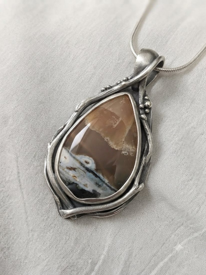 Brown Agate Teardrop Pendant, Brown agate with cream and blue-grey inclusions in a wire-wrapped setting