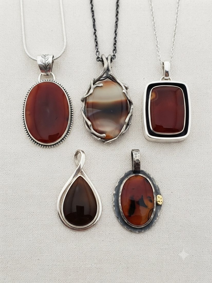 Red Agate Pendants, Deep red and amber banded agate; oval, rectangle and teardrop settings