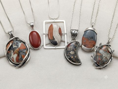 Brecciated Jasper Pendants, Rust-red, white and grey brecciated jasper; wrapped, crescent and open-frame shapes