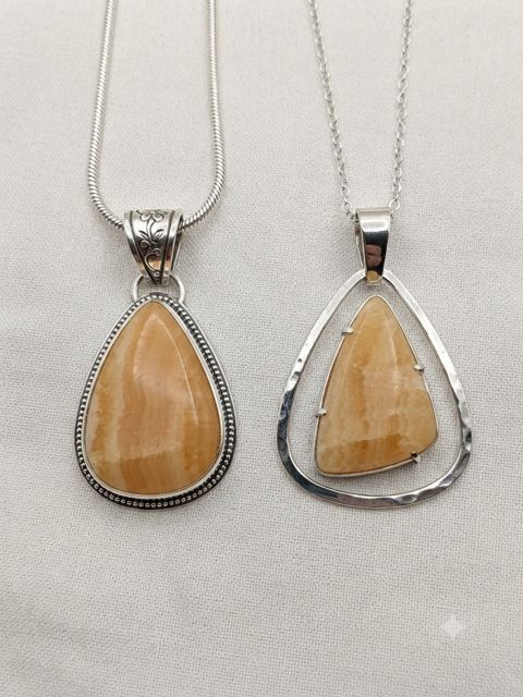 Orange Calcite Pendants, Honey-orange calcite; large teardrop in a beaded bezel or an open triangle frame