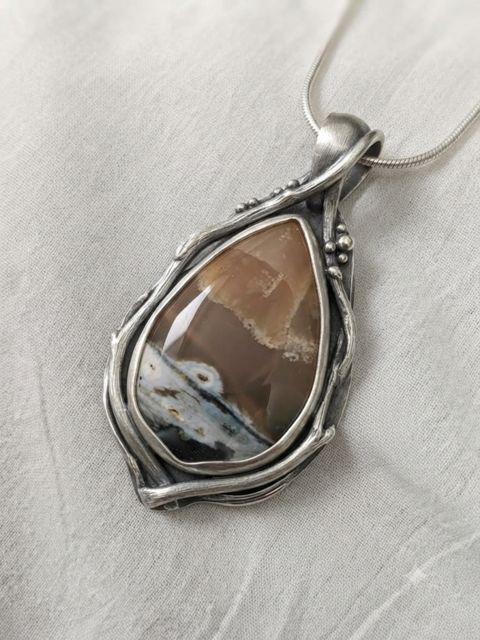 Brown Agate Teardrop Pendant, Brown agate with cream and blue-grey inclusions in a wire-wrapped setting