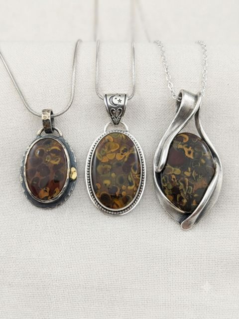 Amber-Brown Jasper Pendants, Patterned brown and golden jasper; oval and wrapped settings