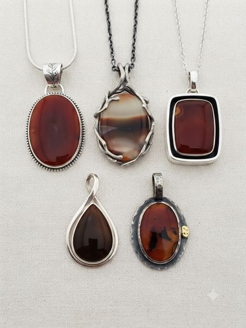 Red Agate Pendants, Deep red and amber banded agate; oval, rectangle and teardrop settings
